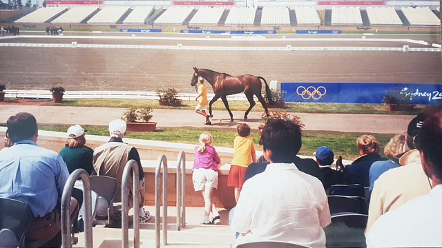 Tara and her brother Owen watching their aunt Nicky trot up at Sydney.